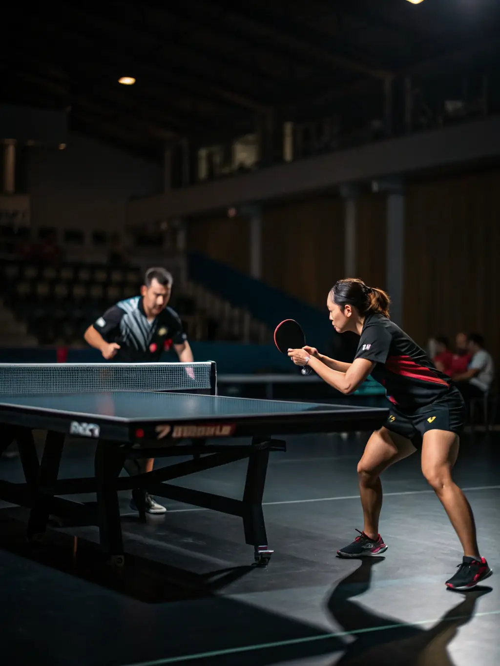 Action shot of two intermediate-level players engaged in a fast-paced rally during a training session at USTT 12.